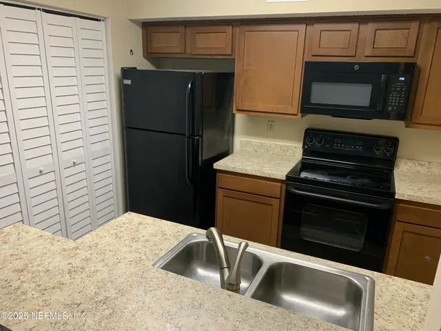 a bathroom with a toilet a sink and bathtub
