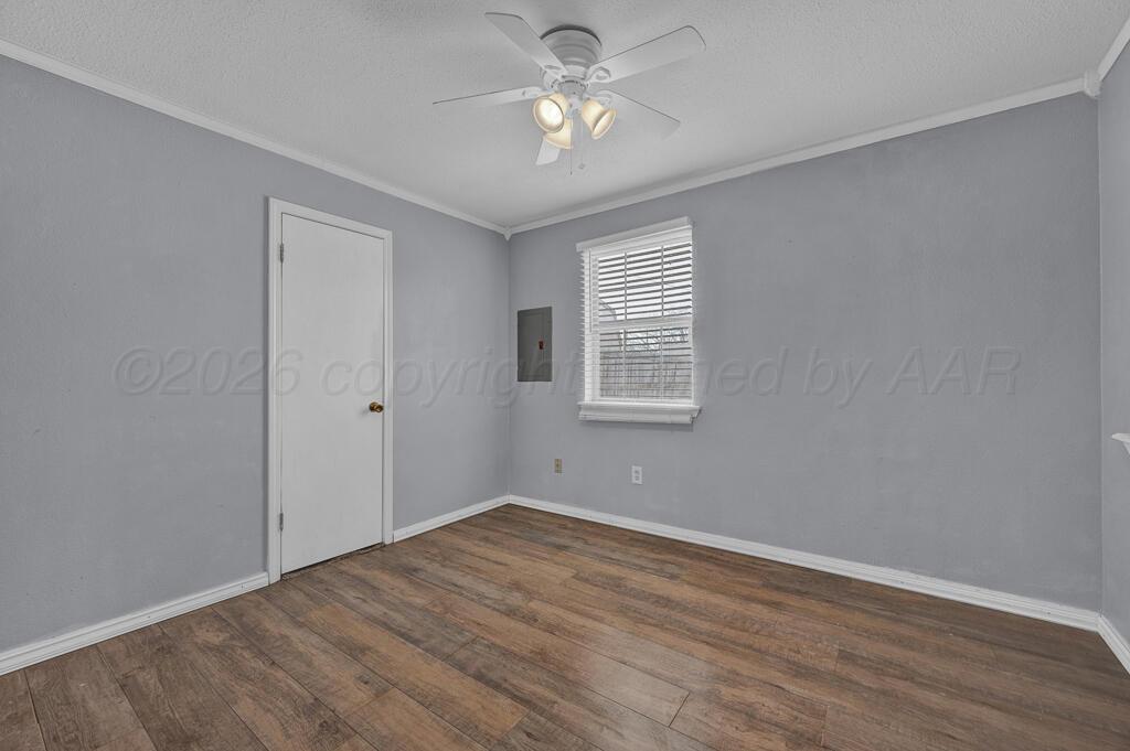 2106 South Cleveland Street Amarillo, TX 79103 - Photo 13 of 26 a view of empty room with wooden floor and fan