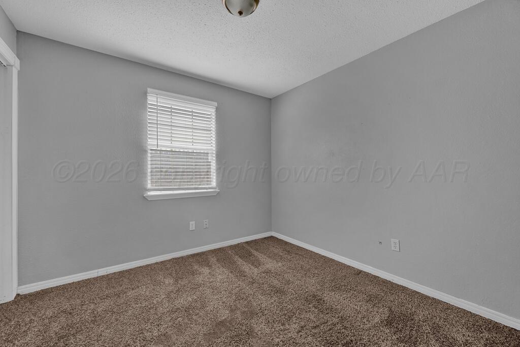 2106 South Cleveland Street Amarillo, TX 79103 - Photo 16 of 26 an empty room with a window