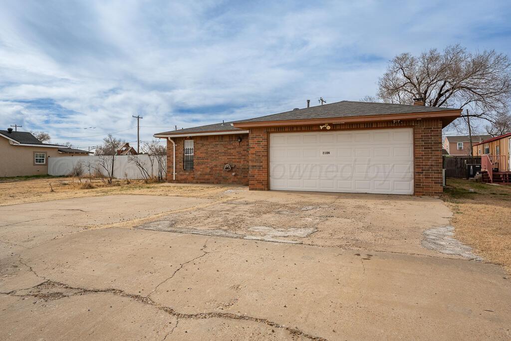 2106 South Cleveland Street Amarillo, TX 79103 - Photo 2 of 26 front view of a house with a outdoor space