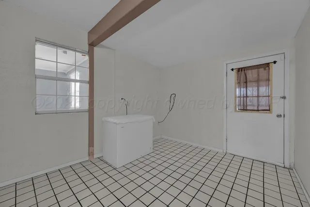 a view of an empty room and window