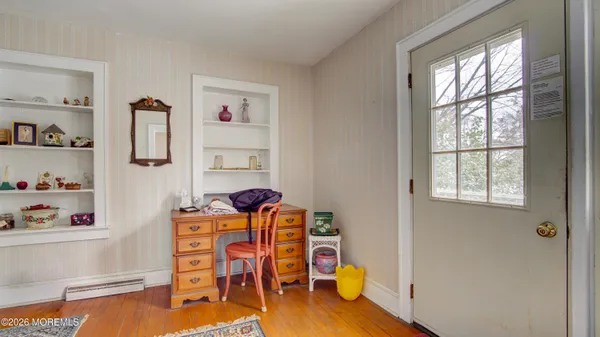 a dining room with furniture and window