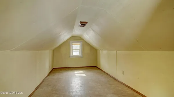 a bedroom with a bed and cabinets