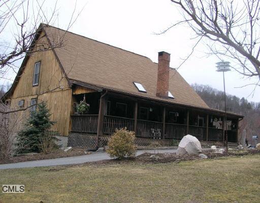 22 Segar Mountain Road Kent, CT 06757 - Photo 1 of 1 a front view of a house with garden