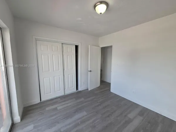a view of a livingroom with wooden floor