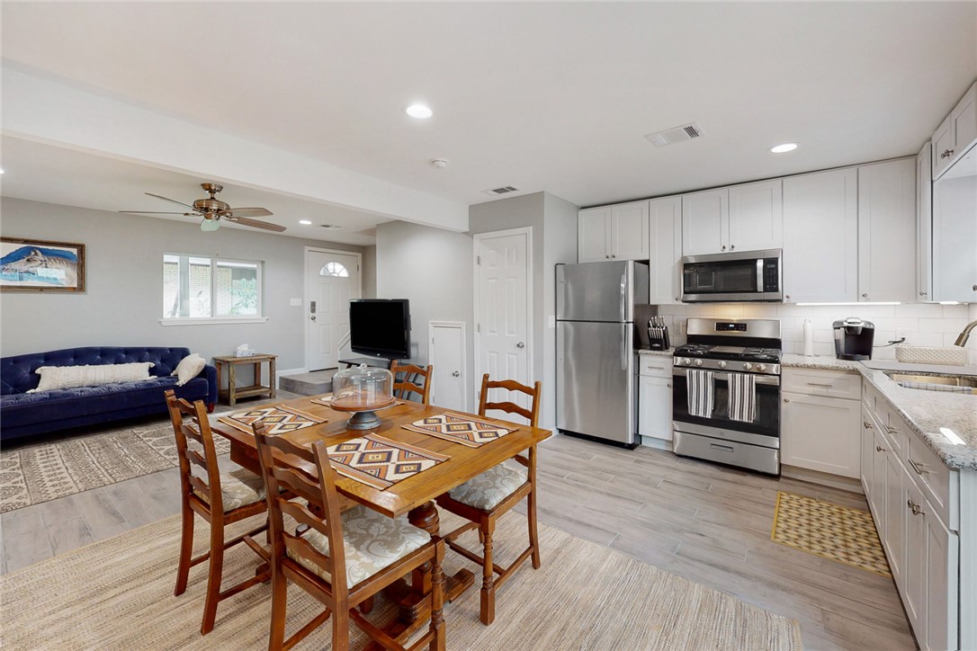 513 Boyett Street, Unit 2 College Station, TX 77840 - Photo 1 of 1 a kitchen with a table and chairs in it