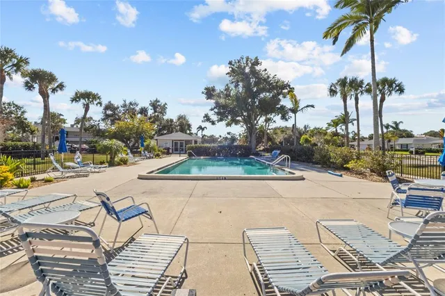 a view of a patio with swimming pool