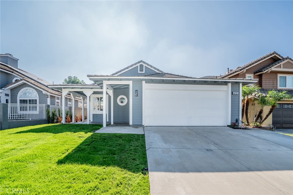 14721 Weeping Willow Lane Fontana, CA 92337 - Photo 1 of 25 a view of a yard in front of a house with a big yard