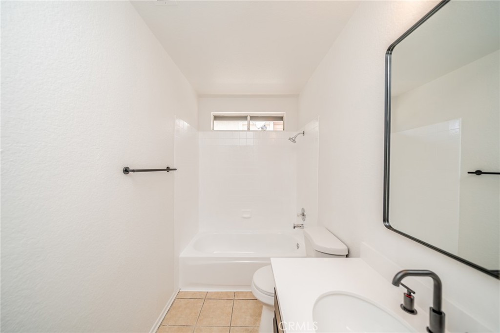 14721 Weeping Willow Lane Fontana, CA 92337 - Photo 11 of 25 a bathroom with a sink a toilet and shower