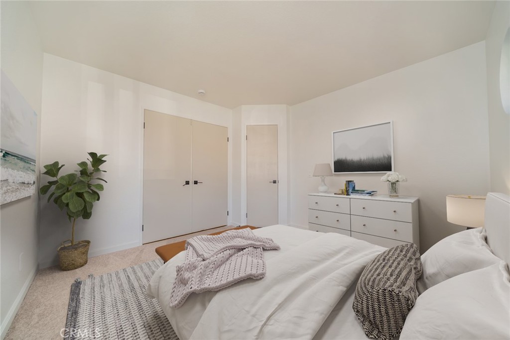 14721 Weeping Willow Lane Fontana, CA 92337 - Photo 15 of 25 a bedroom with a bed and a flat screen tv