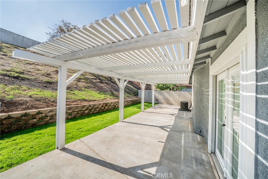 14721 Weeping Willow Lane Fontana, CA 92337 - Photo 17 of 25 a view of a patio with a backyard