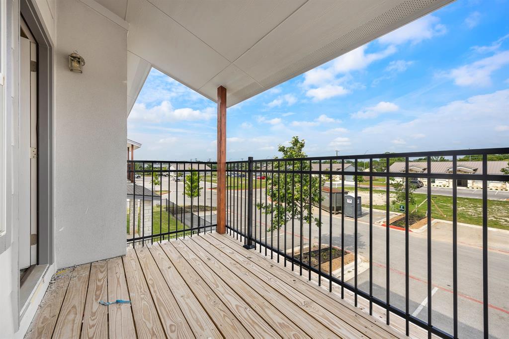 2105 Tiger Trail, Unit 502 Round Rock, TX 78664 - Photo 15 of 16 a view of balcony with wooden floor