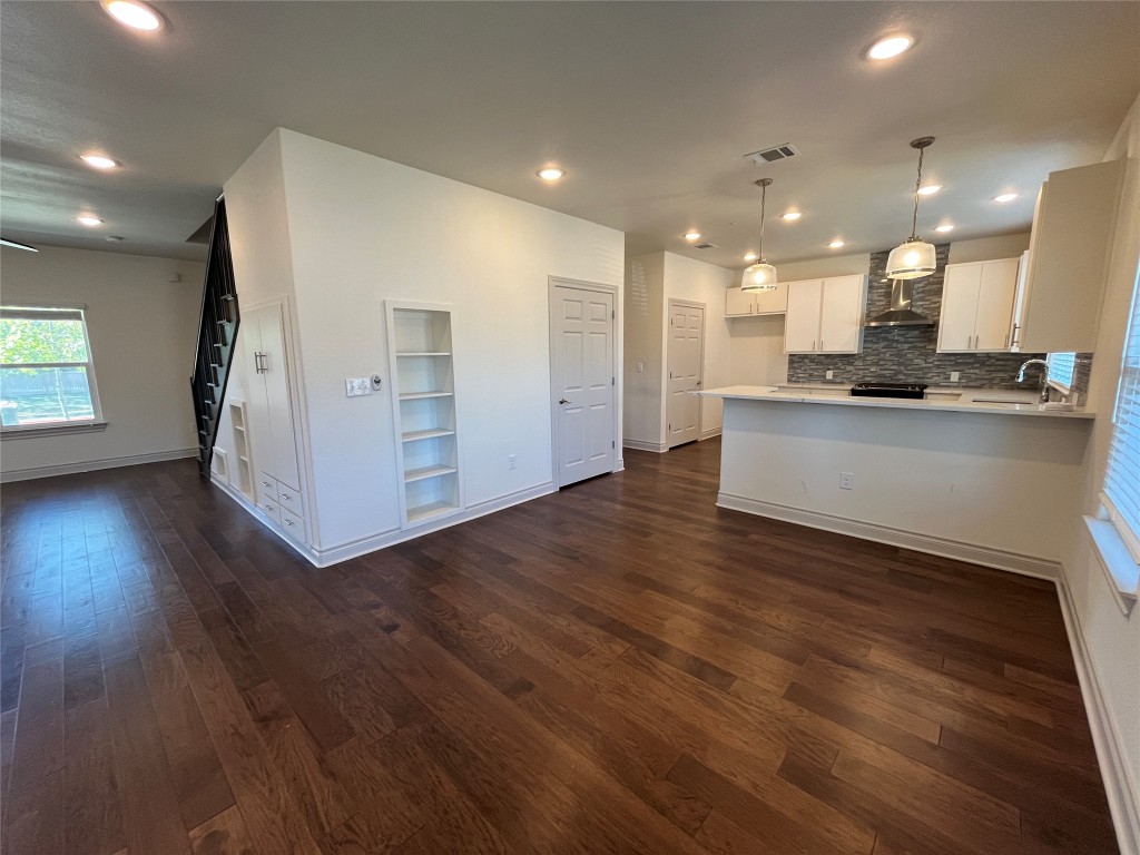 2105 Tiger Trail, Unit 502 Round Rock, TX 78664 - Photo 3 of 16 a view of kitchen with cabinets and wooden floor
