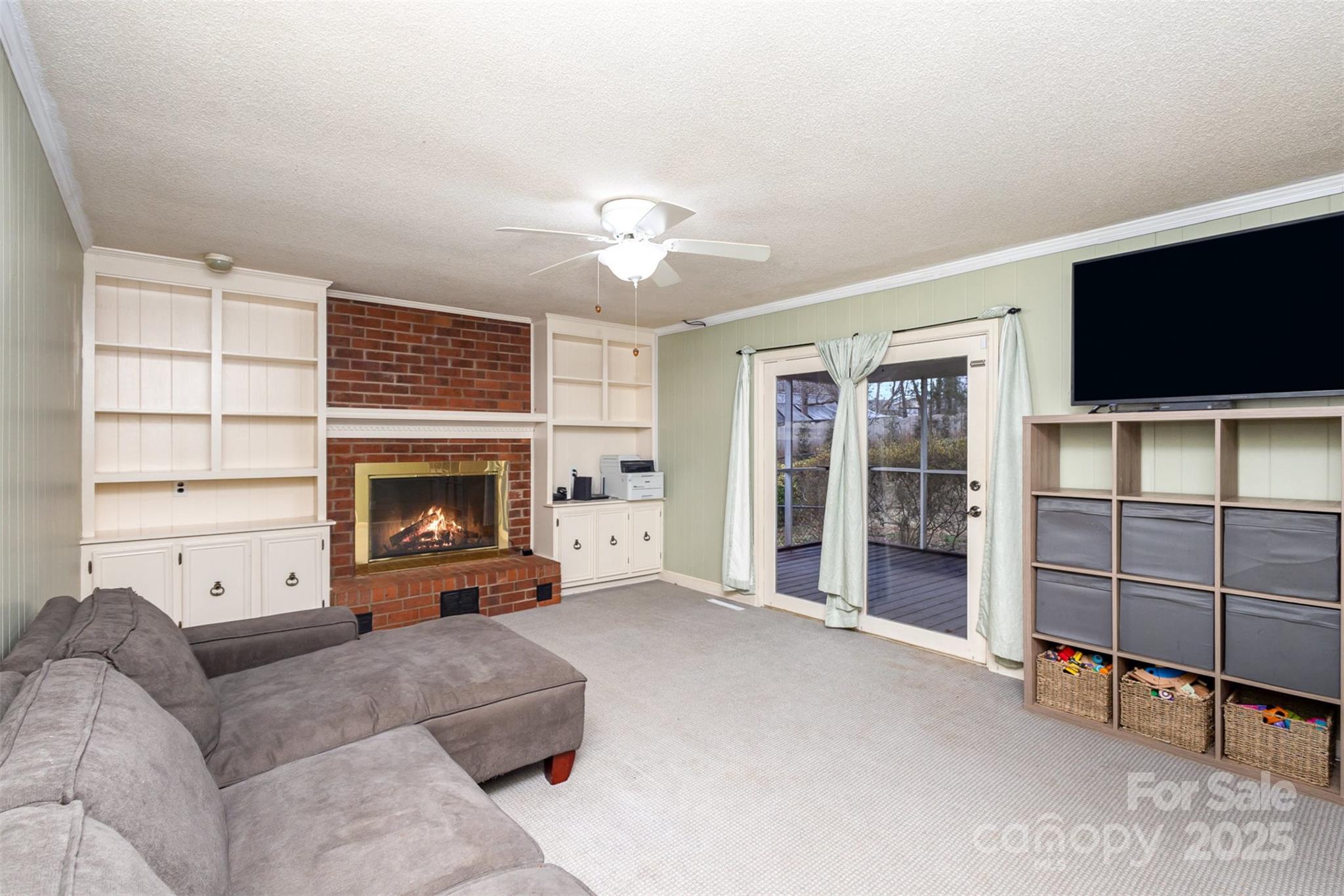 330 Regency Road Salisbury, NC 28147 - Photo 16 of 27 a living room with furniture a flat screen tv and a fireplace