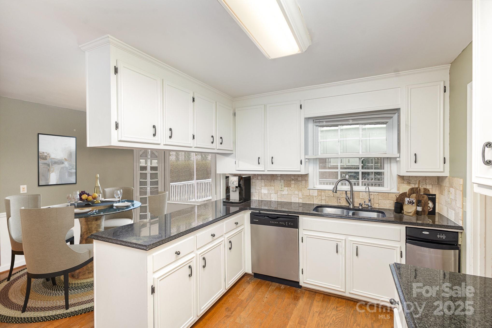 330 Regency Road Salisbury, NC 28147 - Photo 3 of 27 a kitchen with granite countertop white cabinets and white appliances