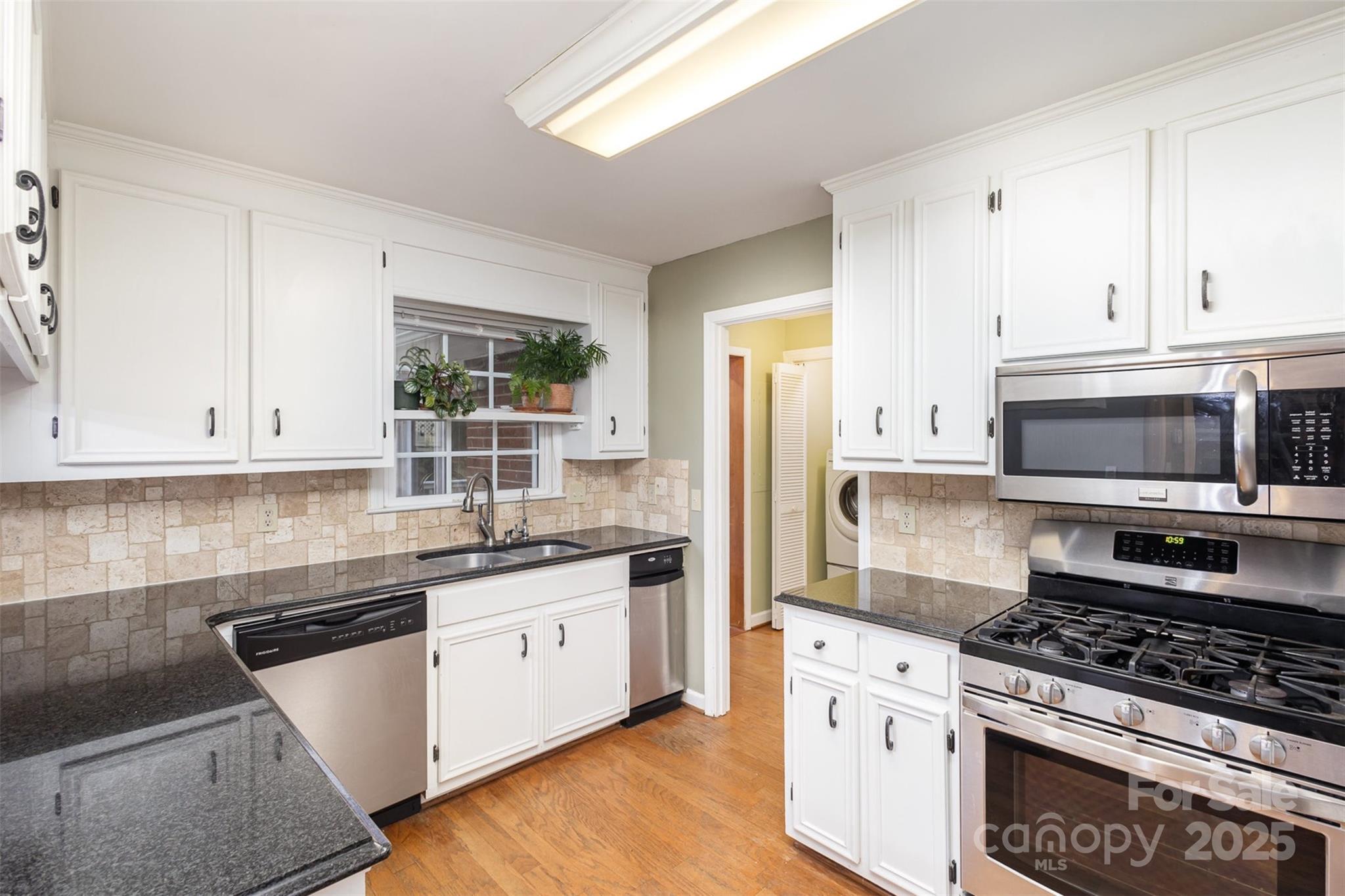 330 Regency Road Salisbury, NC 28147 - Photo 10 of 27 a kitchen with stainless steel appliances granite countertop a stove sink and cabinets