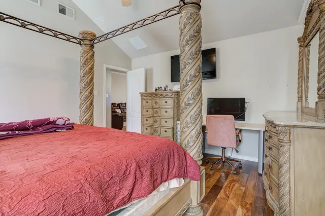 a bed room with a bed and a chair