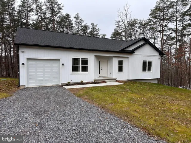 a house with trees in the background