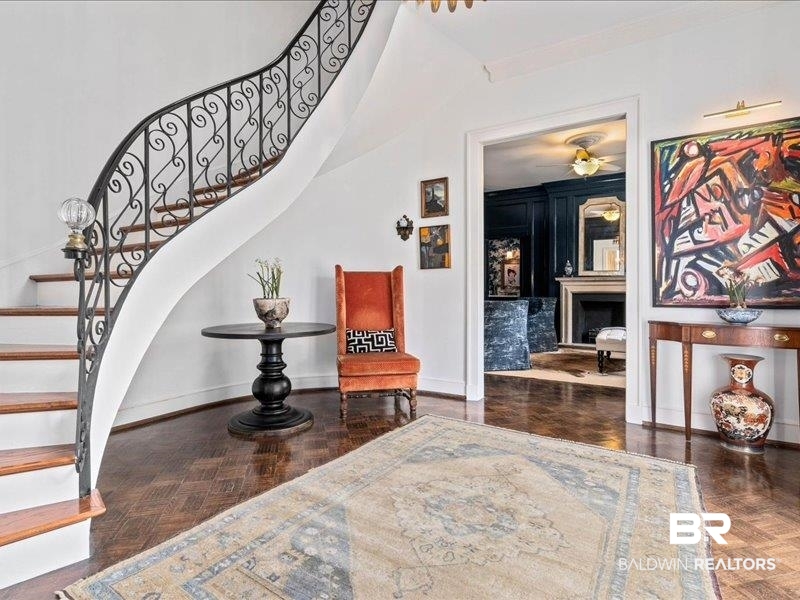 109 Eaton Square Mobile, AL 36608 - Photo 2 of 26 Grand entry featuring a curved staircase with ornate wrought iron railing