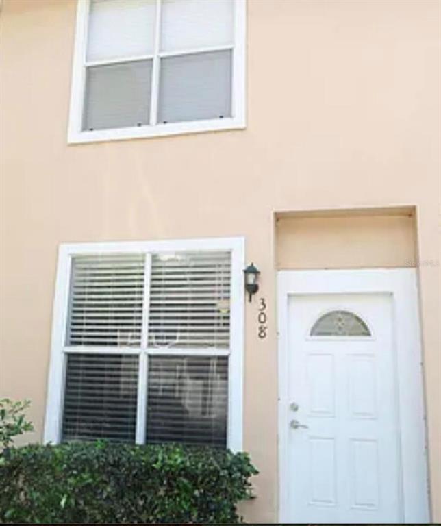 4415 Southwest 34th Street, Unit 308 Gainesville, FL 32608 - Photo 1 of 17 a view of a door and a window