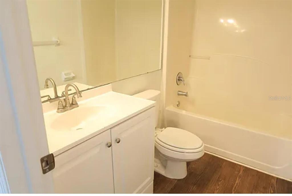4415 Southwest 34th Street, Unit 308 Gainesville, FL 32608 - Photo 14 of 17 a bathroom with a sink a toilet and shower