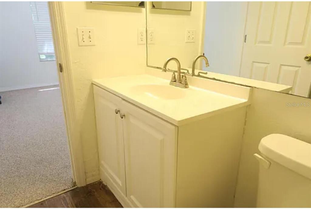 4415 Southwest 34th Street, Unit 308 Gainesville, FL 32608 - Photo 15 of 17 a bathroom with a sink and a mirror