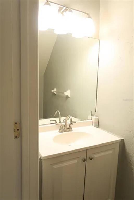 4415 Southwest 34th Street, Unit 308 Gainesville, FL 32608 - Photo 2 of 17 a bathroom with a sink and a mirror