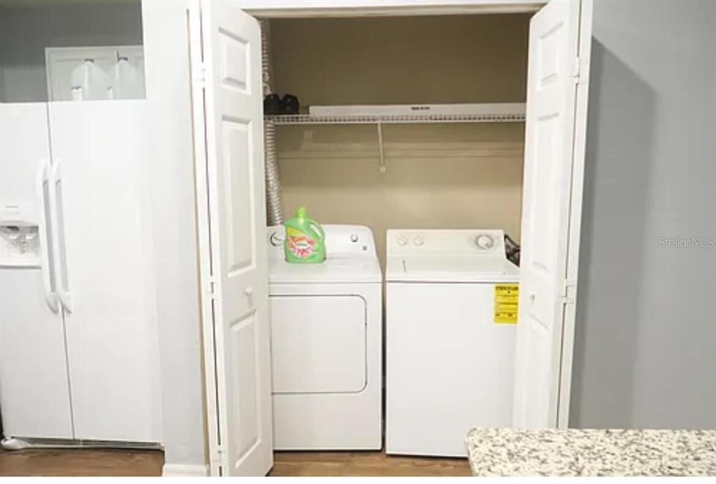 4415 Southwest 34th Street, Unit 308 Gainesville, FL 32608 - Photo 7 of 17 a utility room with dryer and washer
