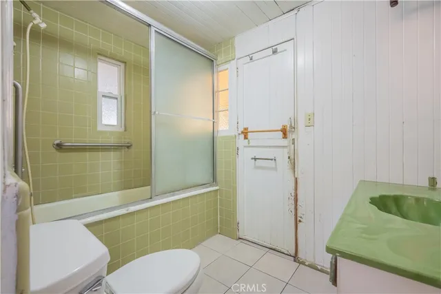 a view of an entryway with wooden floors