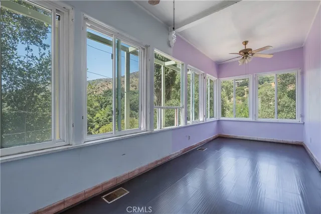 a kitchen with a sink a counter top space and cabinets
