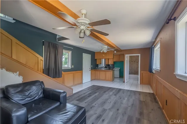 a bathroom with a granite countertop sink a toilet and shower
