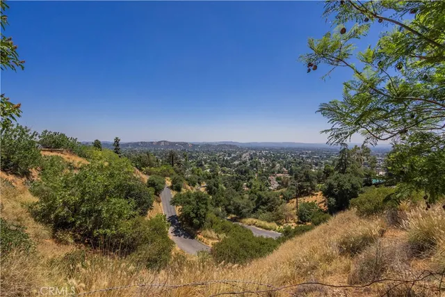 a backyard of a house with a yard and mountain view