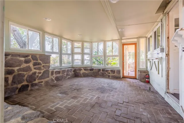 a kitchen that has a sink and a stove in it