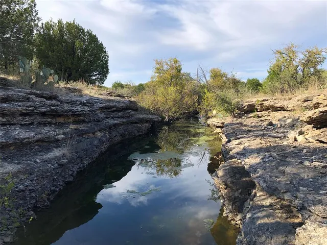 a view of a lake with mountains in the background