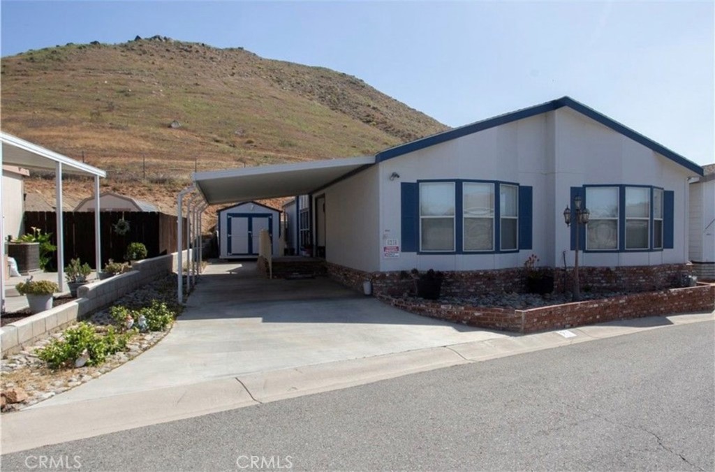 3700 Quartz Canyon Road, Unit 21 Jurupa Valley, CA 92509 - Photo 1 of 11 a house view with a backyard space