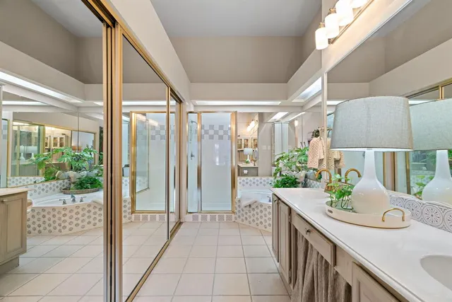 a bathroom with a tub and shower