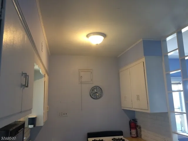 a view of staircase with white walls