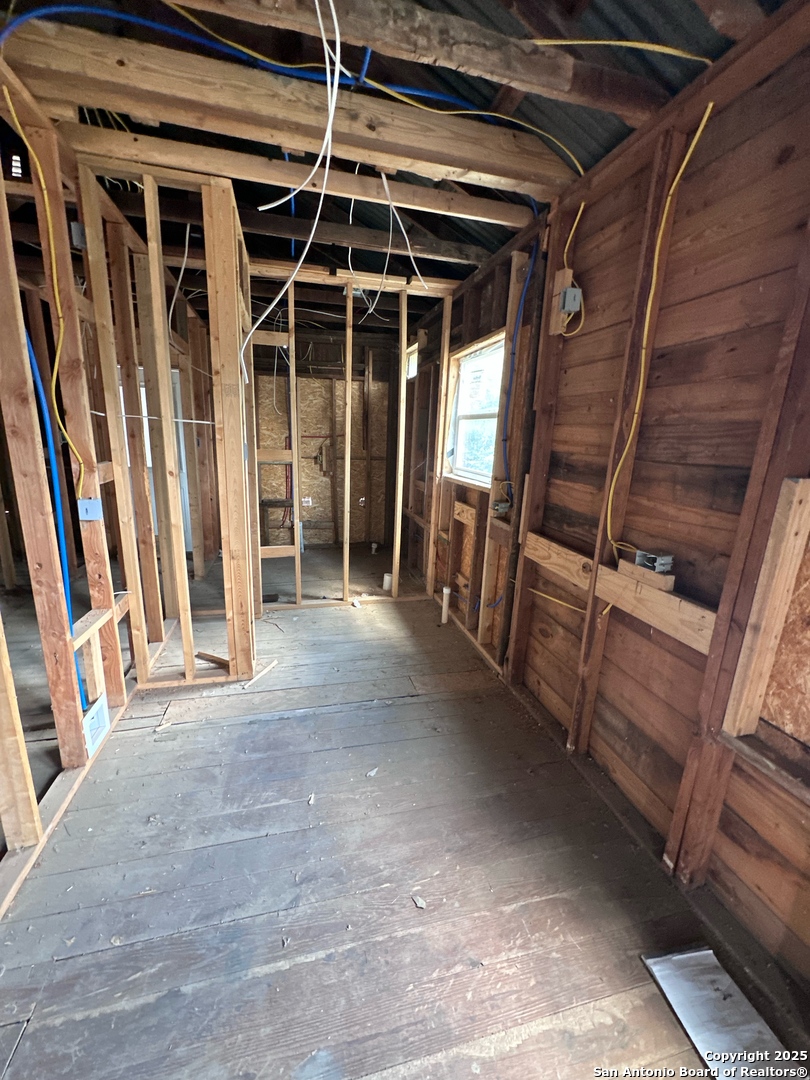 710 5th Street Natalia, TX 78059 - Photo 7 of 14 a view of an empty room with wooden roof and furniture