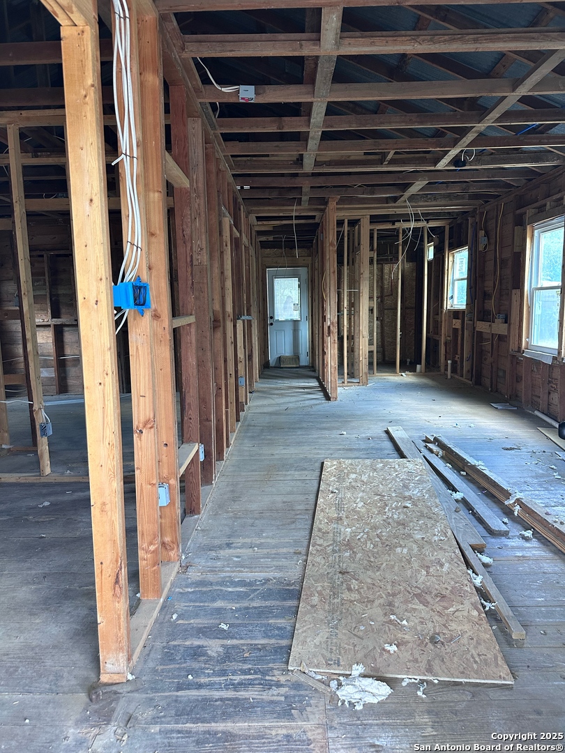 710 5th Street Natalia, TX 78059 - Photo 10 of 14 an entryway of a house with wooden floor