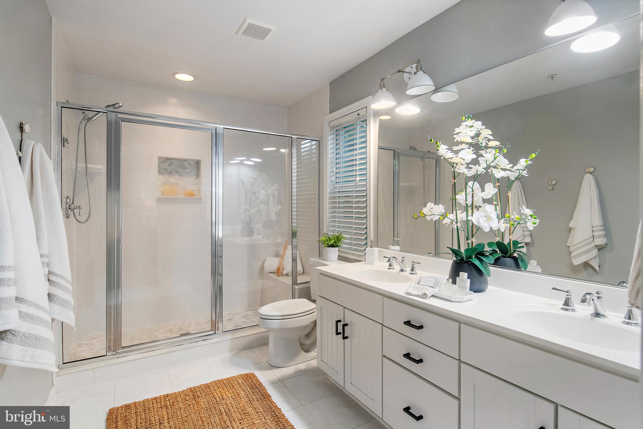 129 Gibson Road Annapolis, MD 21401 - Photo 26 of 50 a bathroom with a double vanity sink mirror and shower