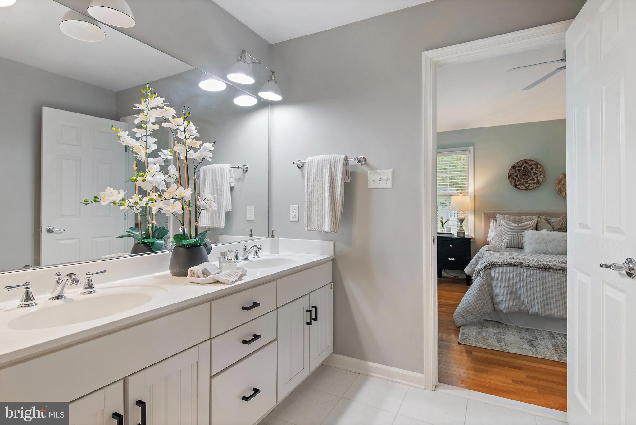 129 Gibson Road Annapolis, MD 21401 - Photo 28 of 50 a en suite bathroom with a double vanity sink and a mirror