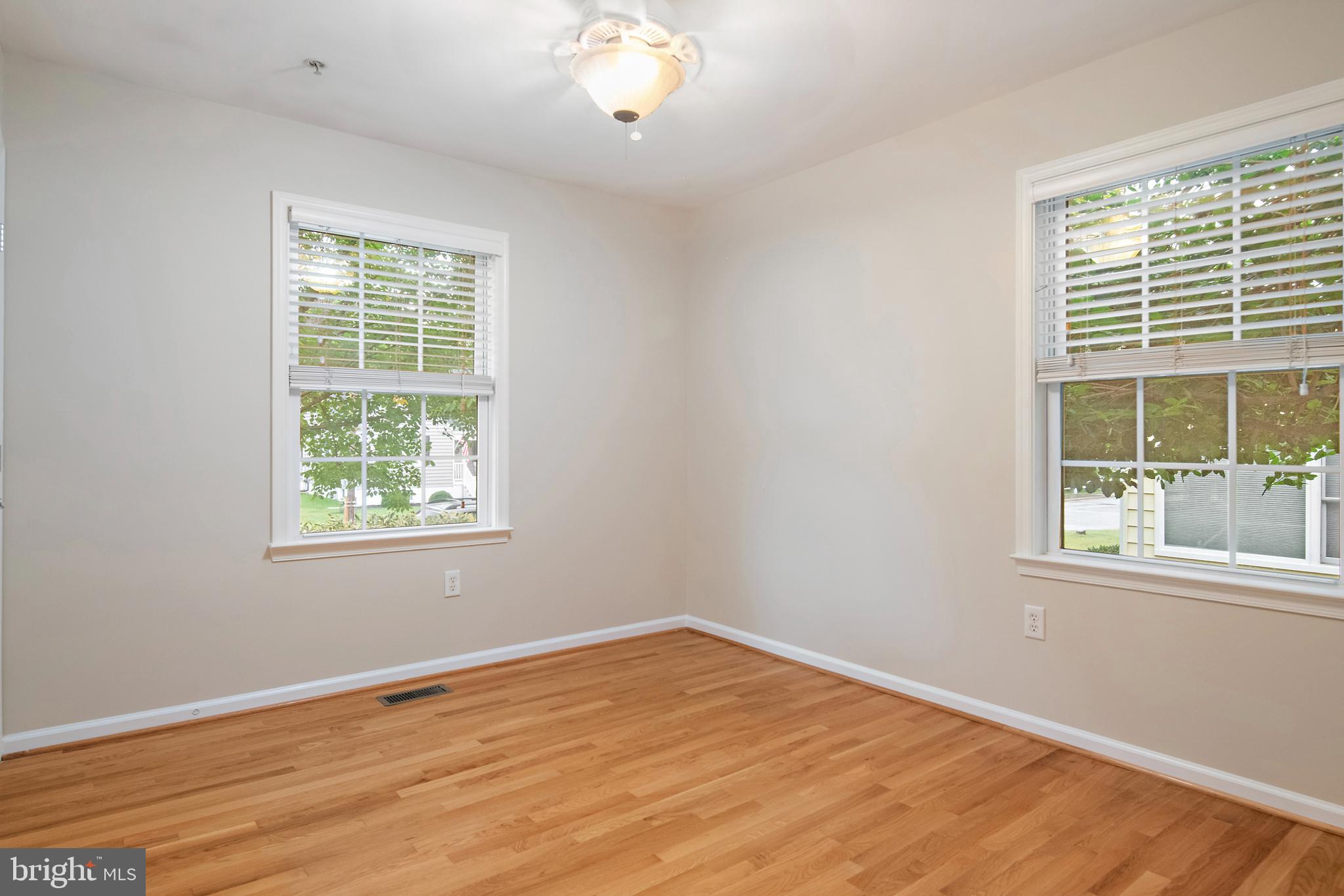 129 Gibson Road Annapolis, MD 21401 - Photo 29 of 50 an empty room with wooden floor and windows