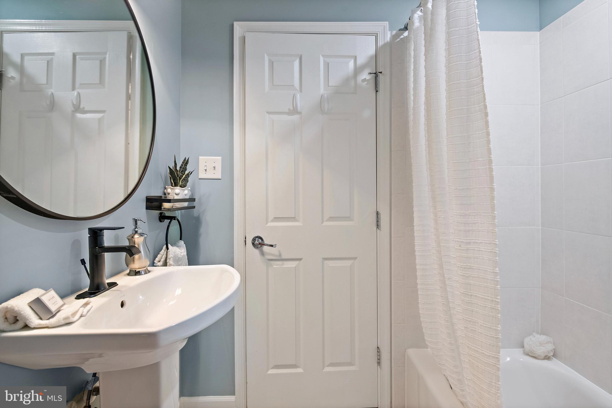 129 Gibson Road Annapolis, MD 21401 - Photo 31 of 50 a bathroom with a sink vanity and a mirror