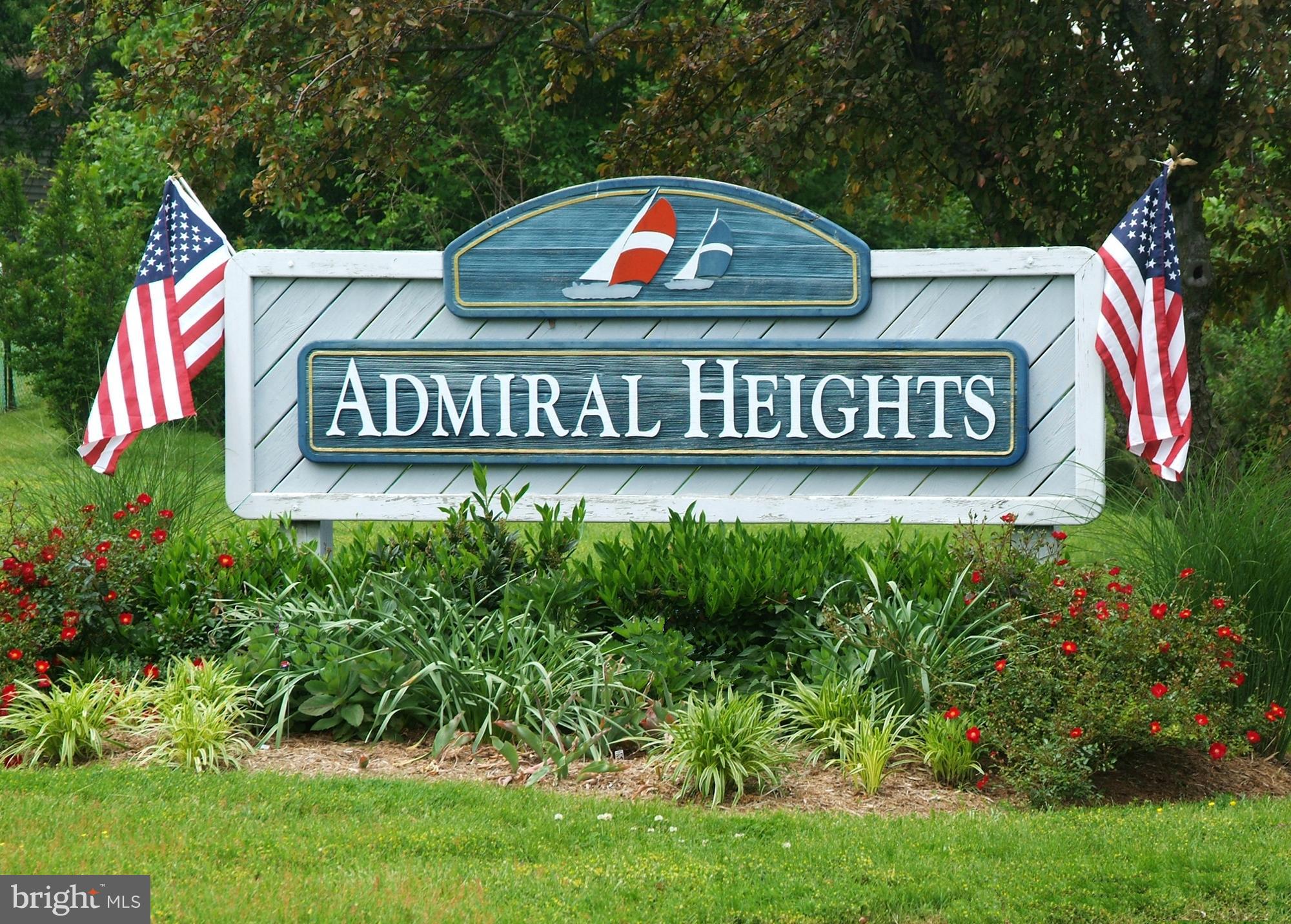 129 Gibson Road Annapolis, MD 21401 - Photo 46 of 50 a street sign sitting on a lush green field