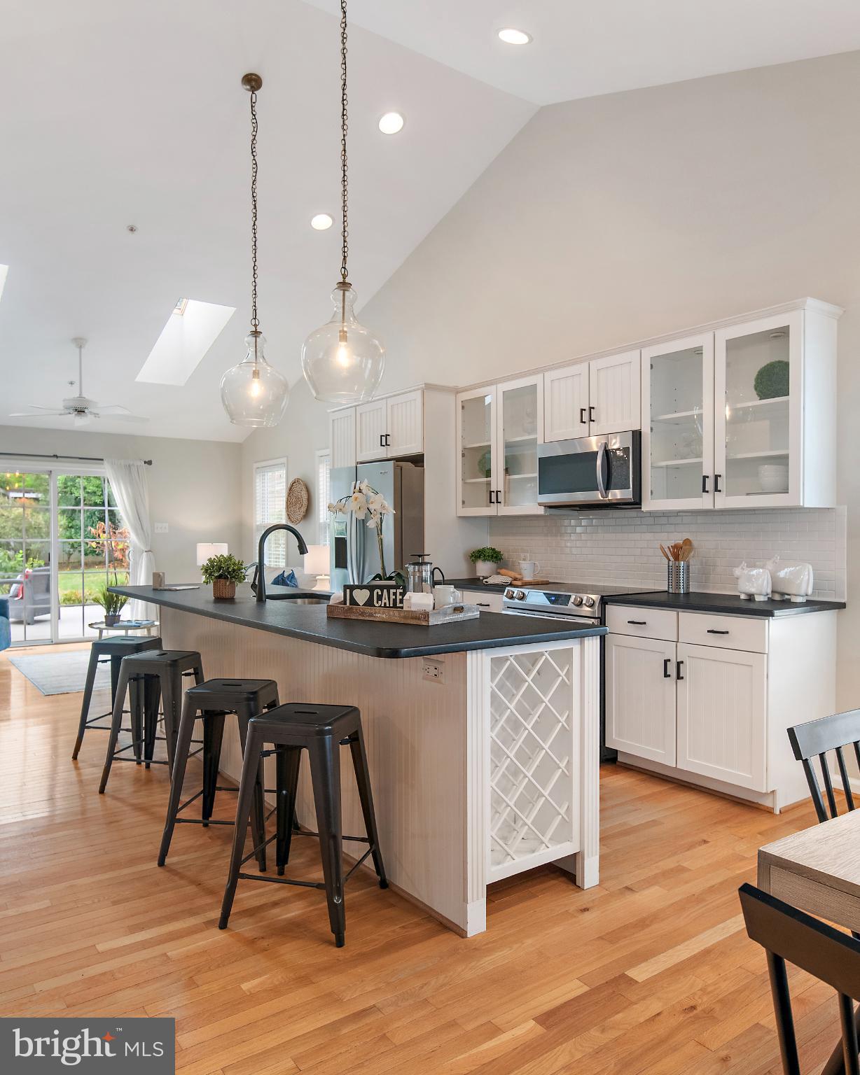 129 Gibson Road Annapolis, MD 21401 - Photo 7 of 50 a kitchen with stainless steel appliances granite countertop a stove a sink and a wooden floors