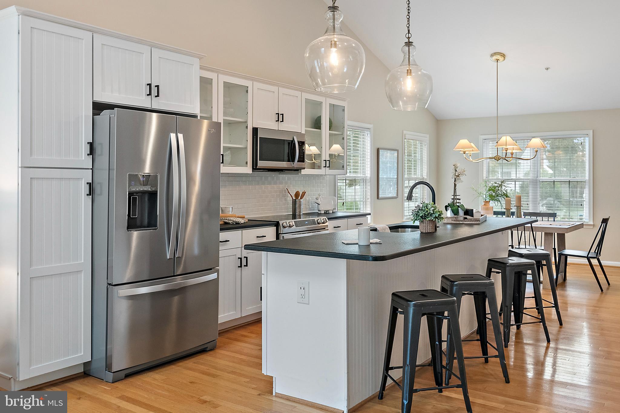 129 Gibson Road Annapolis, MD 21401 - Photo 10 of 50 a kitchen with kitchen island granite countertop a sink a center island stainless steel appliances and cabinets