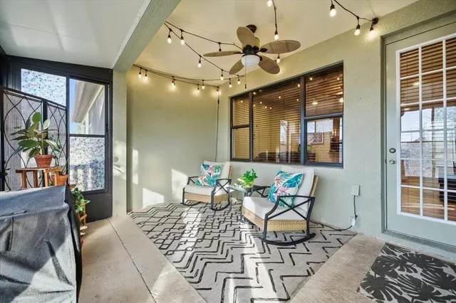 a view of a yard with wooden fence and large trees