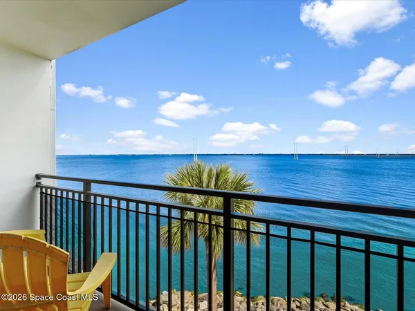 a view of a balcony with wooden floor
