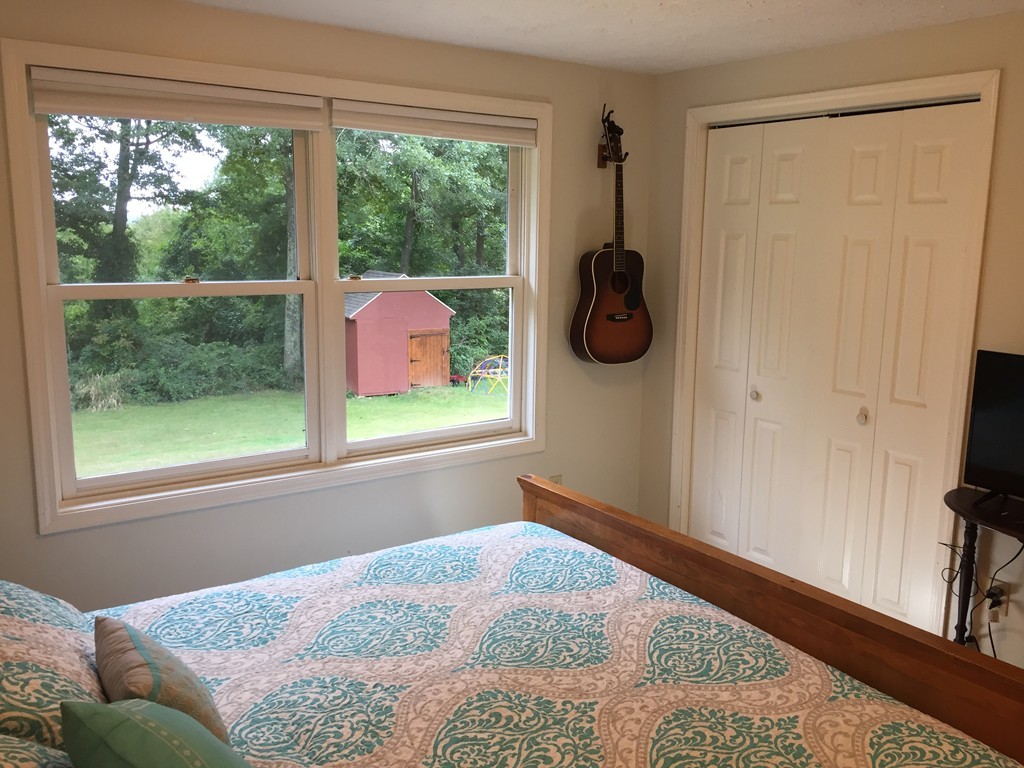 109 Fisherdick Road Ware, MA 01082 - Photo 14 of 27 a bedroom with a bed and a window