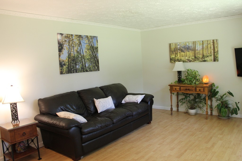 109 Fisherdick Road Ware, MA 01082 - Photo 5 of 27 a living room with furniture and a lamp